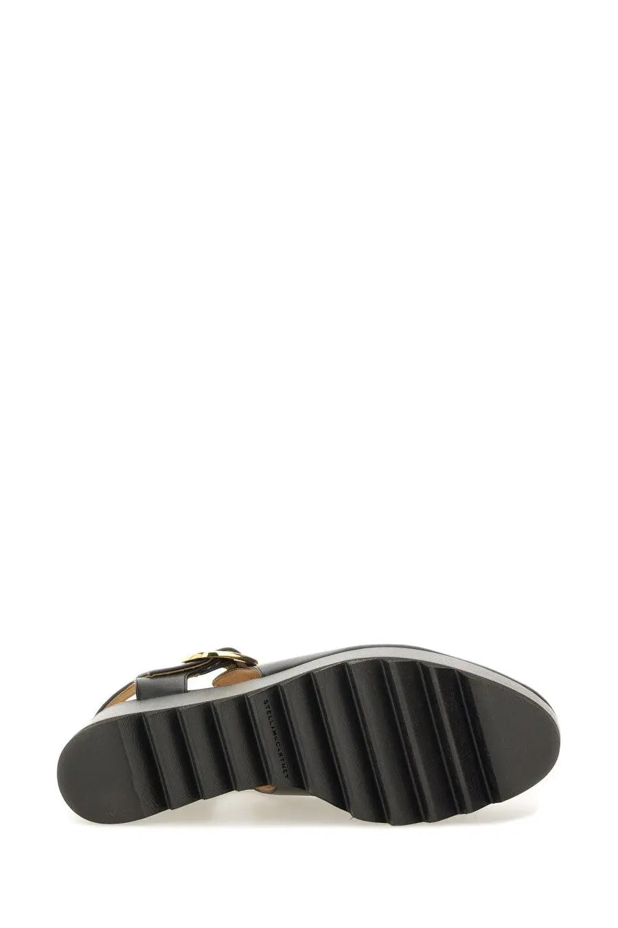 Stella McCartney women’s Elyse black leather wedge sandal with gold-tone buckle and textured rubber sole