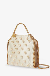 Off-white pearl-studded Stella McCartney Falabella satin crossbody bag with gold-tone chain handles and stitched edge