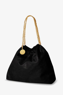 Stella McCartney women’s black satin Falabella shaggy deer tote bag with gold chain straps and circular pendant