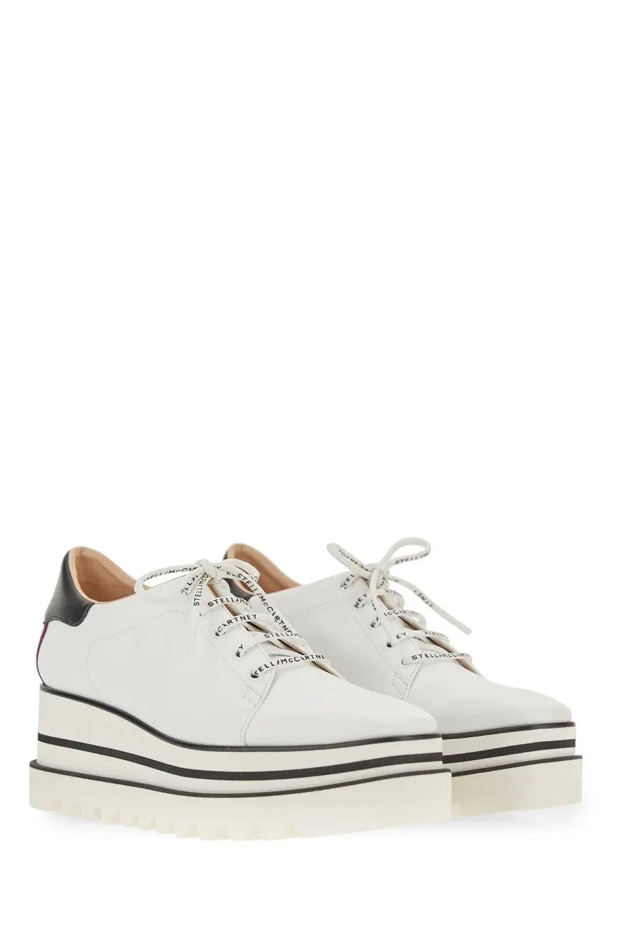 Stella McCartney women’s lace white platform sneakers in white leather with black accents and bold striped sole