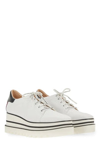 Stella McCartney women’s lace white platform sneakers in white leather with black accents and bold striped sole