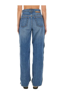 Back view of stella mccartney women’s blue high waisted wide leg denim jeans with classic pockets and subtle fading