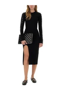 Black studded clutch with white polka dots and silver-toned hardware paired with stella mccartney women’s midi dress black