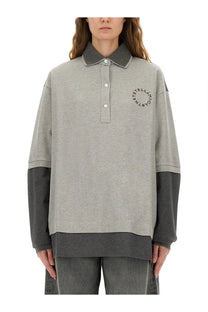 Stella McCartney women’s oversize grey polo shirt with dark gray collar sleeve cuffs and hem made from soft fabric