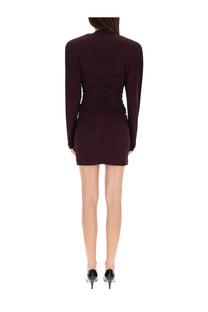 A sleek burgundy Stella McCartney women’s pleated mini dress with long sleeves and a ruched back detail shown from behind