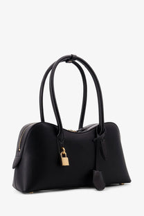 Black leather Stella McCartney Stella Ryder medium vegan leather shoulder bag with gold-tone lock and hardware
