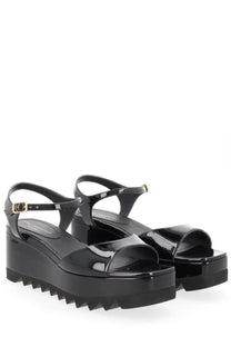 Stella McCartney women’s sandal Elyse black patent leather platform sandals with chunky serrated sole and gold buckles