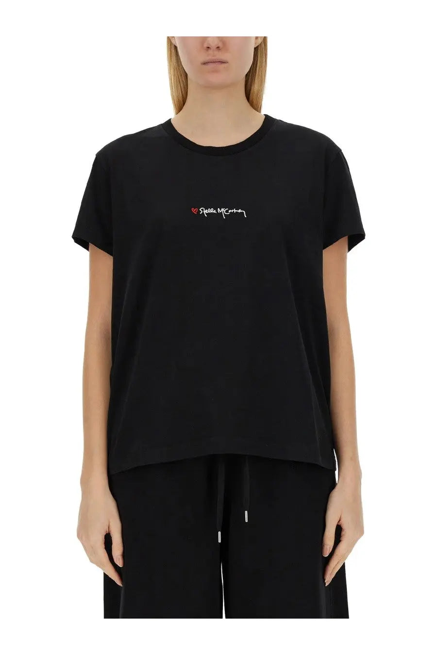 Stella McCartney women’s black short-sleeved cotton t-shirt with white embroidered riccardo mccann logo and heart on chest