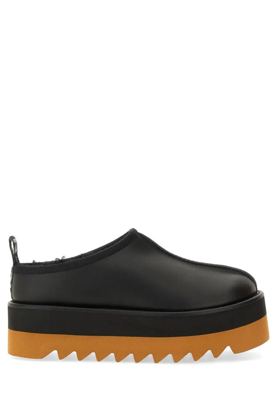 Stella McCartney women’s sneak Elyse slip-on platform shoe in black leather with bold orange serrated sole