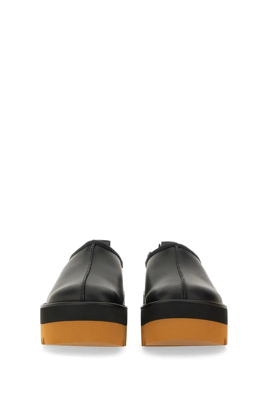 Stella McCartney women’s sneak Elyse slip-on black leather platform shoes with bold orange rubber sole