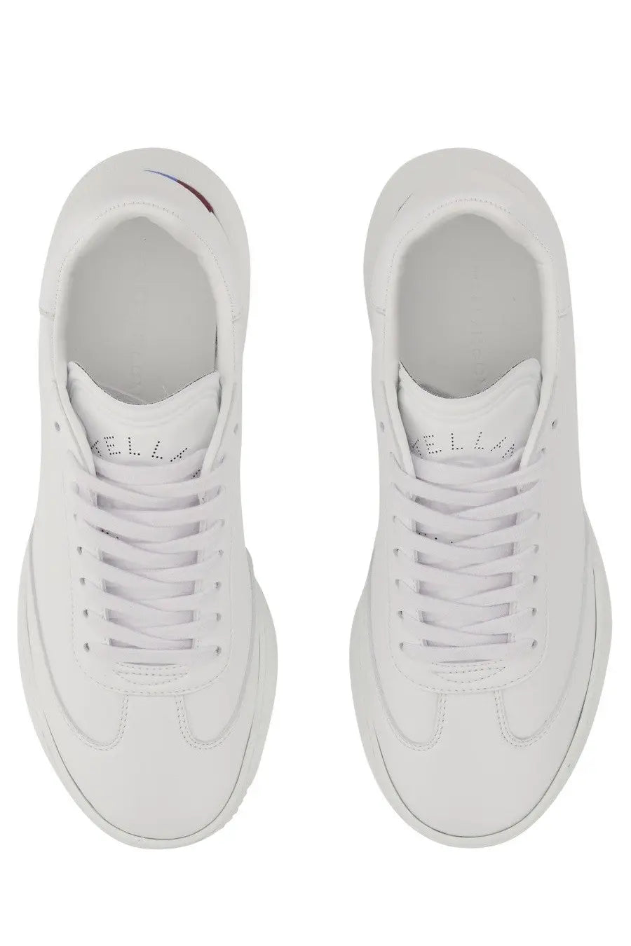 Stella McCartney women’s white leather sneakers with chunky sole and subtle branding on the tongue