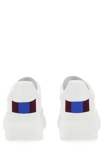 White platform stella mccartney women’s sneaker loop pink showing bold blue and maroon striped heel accent back view