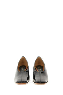 Stella McCartney women’s black patent leather square toe pumps with a sleek minimalist design