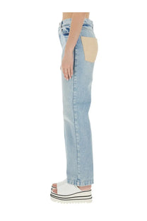 Stella McCartney women’s straight leg light-wash denim jeans with beige patch pocket for casual wear