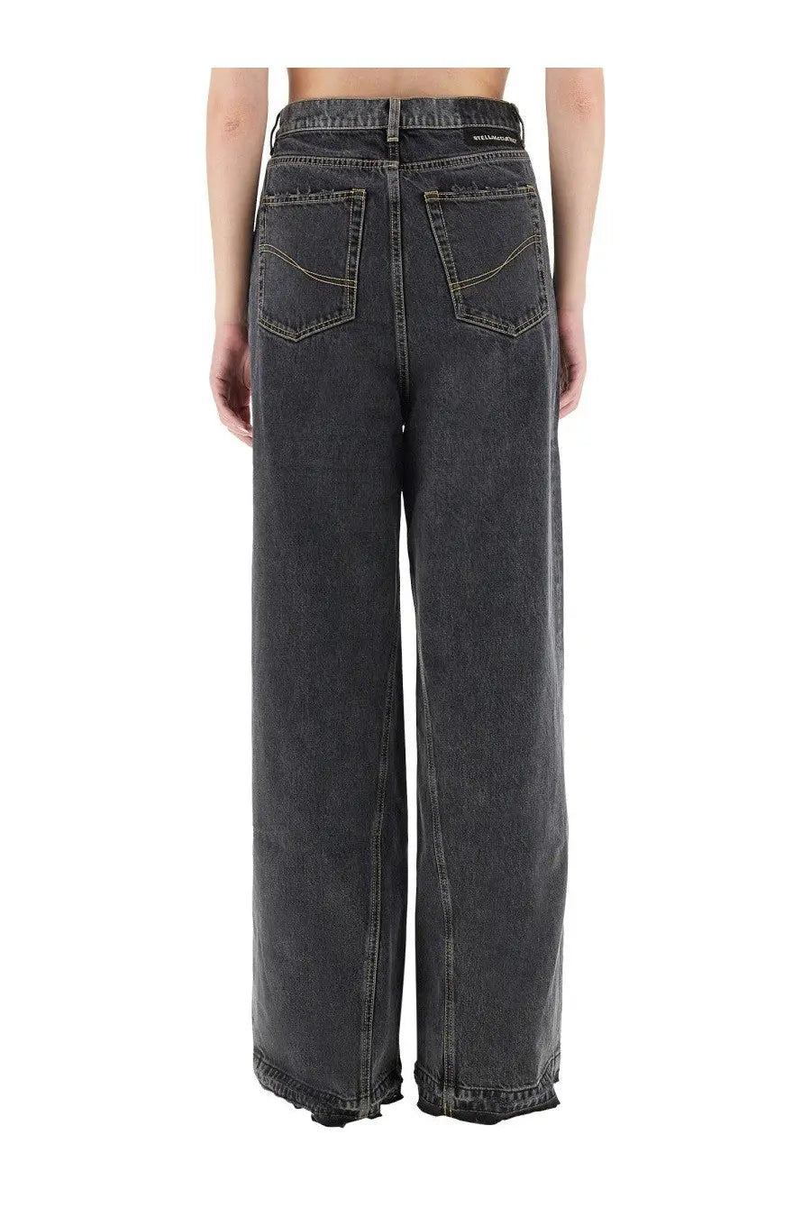 Stella mccartney women’s wide leg jeans in dark gray denim with faded distressed finish and classic back pockets from back view