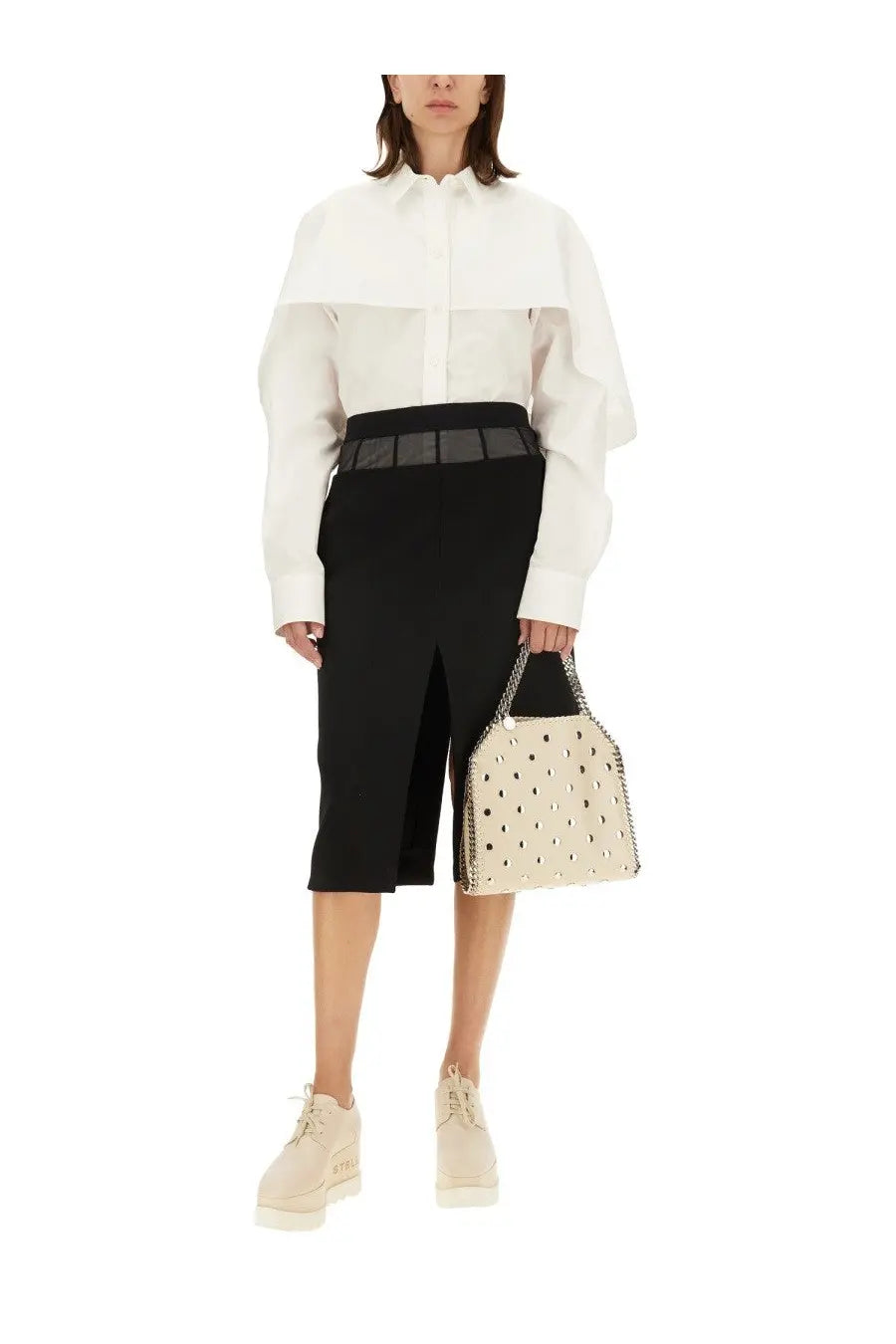 Cream-colored leather handbag with black polka dots and chain strap paired with stella mccartney womens wool skirt black
