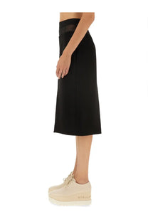 Black high-waisted wool midi skirt by Stella McCartney with a sheer mesh panel at the waistband