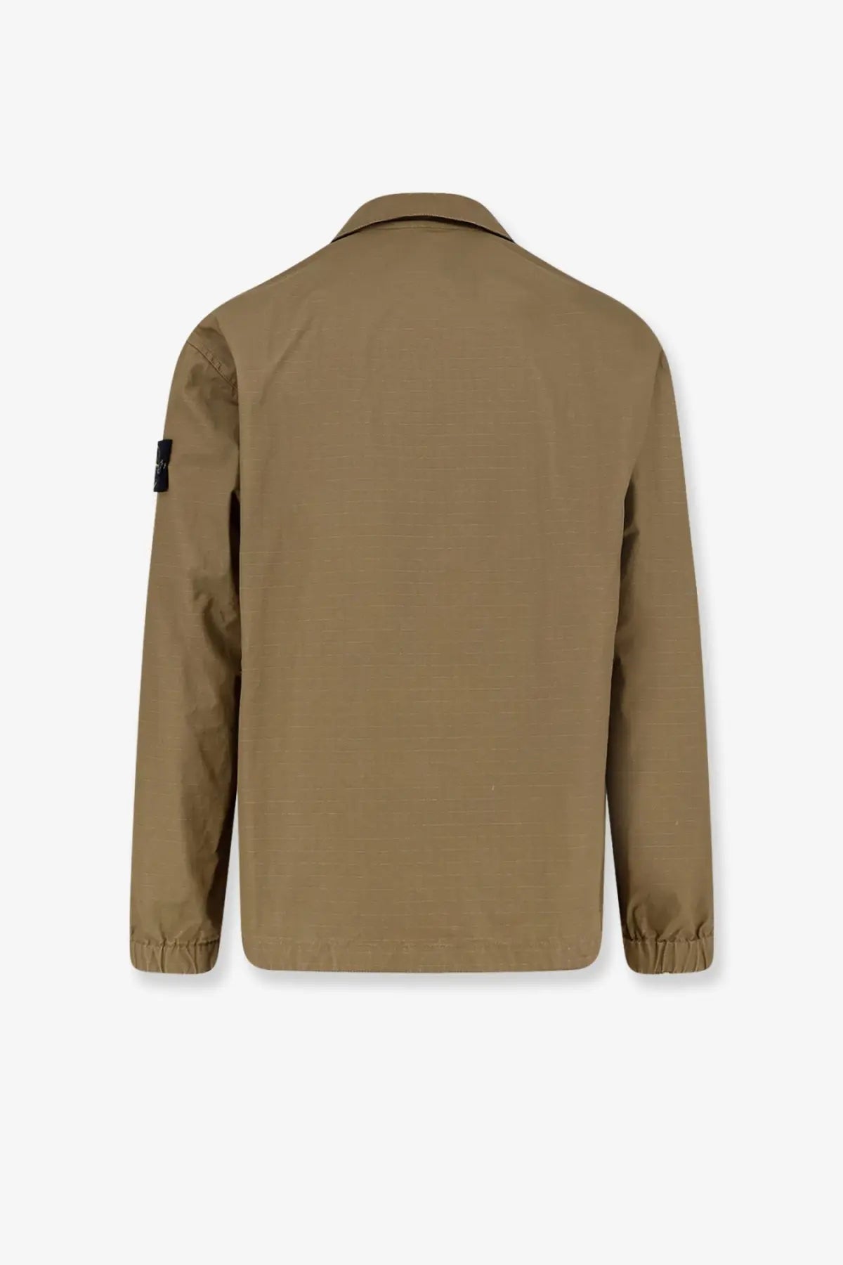 Stone Island men’s tan utility jacket with subtle textured weave elasticated cuffs and black patch on left sleeve