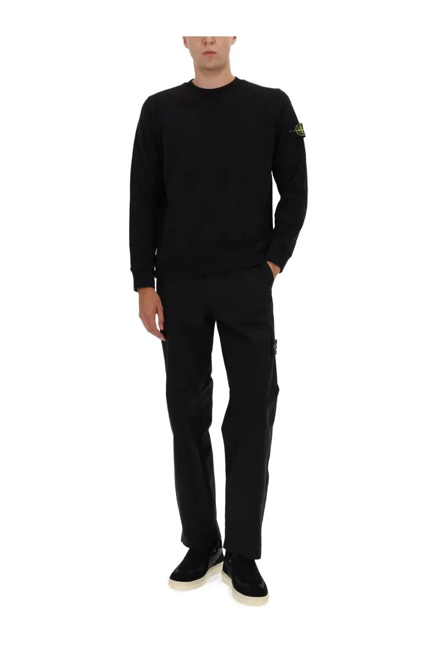 Stone Island men’s black cotton sweatshirt with long sleeves and small yellow logo patch on left sleeve in soft knit fabric