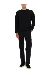 Stone Island men’s black cotton sweatshirt with long sleeves and small yellow logo patch on left sleeve in soft knit fabric