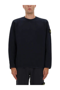Stone Island men’s black cotton sweatshirt with long sleeves and a subtle yellow logo patch on the left sleeve