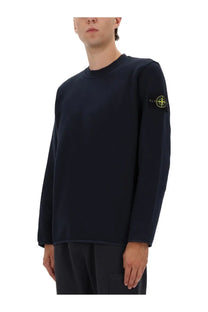 Stone Island men’s cotton sweatshirt in dark navy with a subtle yellow logo patch on the left sleeve