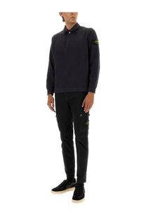 Stone Island men’s black cotton vanisé long-sleeved polo shirt with neon yellow logo patches on sleeve and thigh