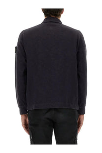Stone island men’s dark navy blue cotton vanisé jacket with textured fabric and black logo patch on left sleeve