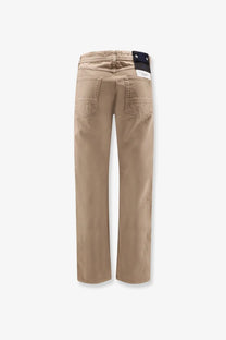 Beige straight-leg chino pants with subtle stitching in stone island men’s denim trousers desert design