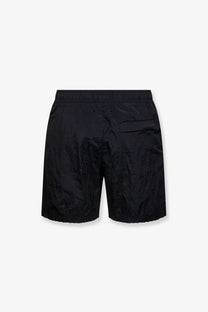 Stone island men’s econylon swim trunks in black featuring textured fabric with subtle pattern and elastic waistband