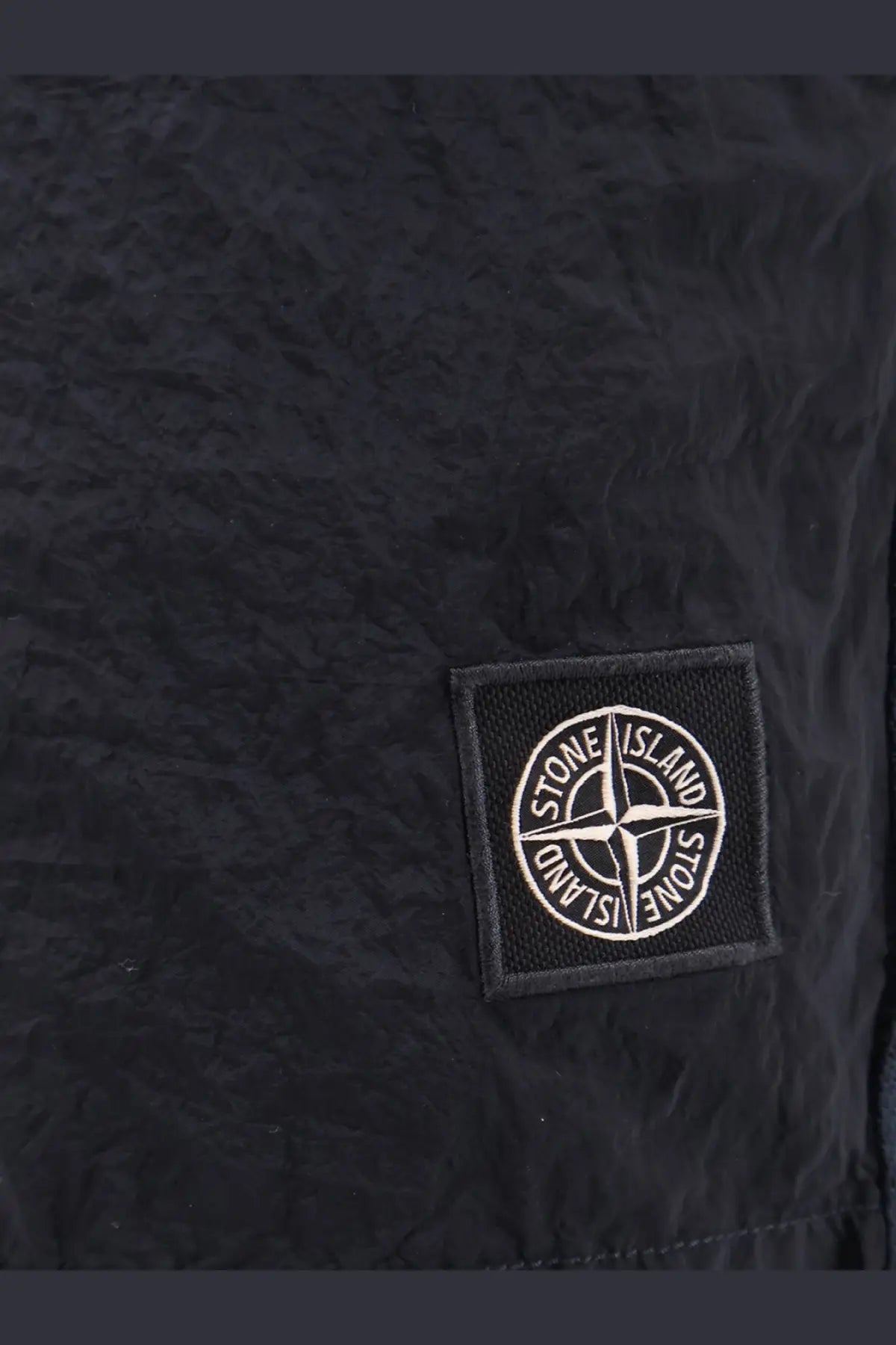 Stone island men’s econylon swim trunks blue with black stone island patch and white embroidered logo on textured fabric