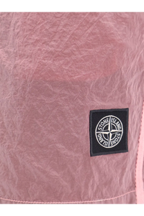 Pink textured fabric with black stone island logo patch on stone island men’s econylon swim trunks