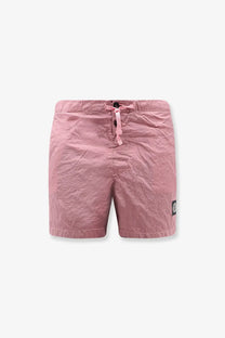 Stone Island men’s pink econylon swim trunks with textured fabric drawstring waist and black logo patch on the side