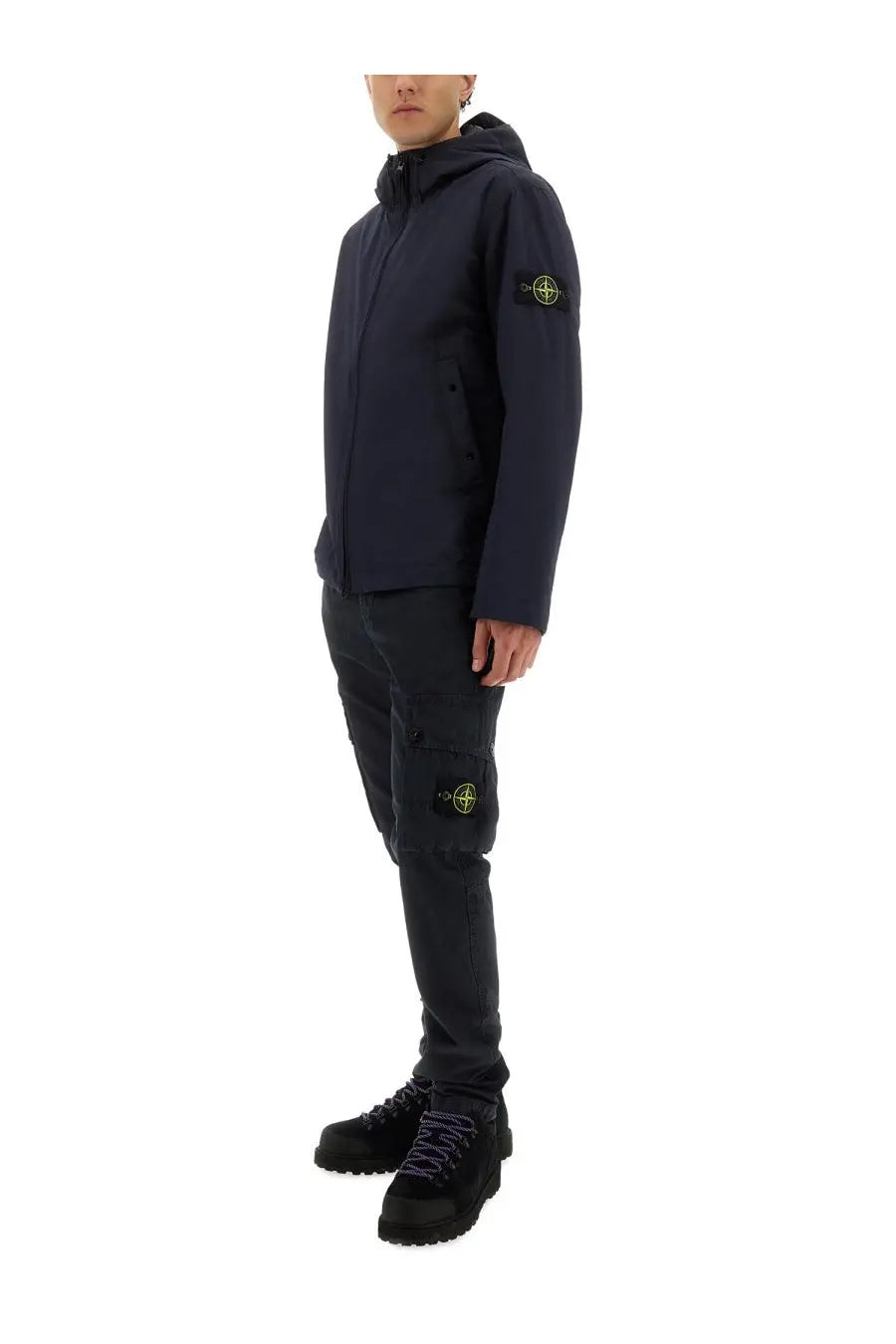 Stone island men’s hooded jacket blue in dark navy with yellow logo patches on sleeve and thigh made from stone fabric