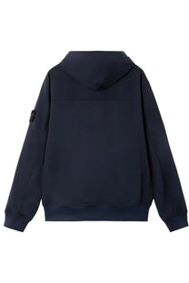 Stone island men’s hooded parka in dark navy blue with subtle textured fabric and black logo patch on left sleeve