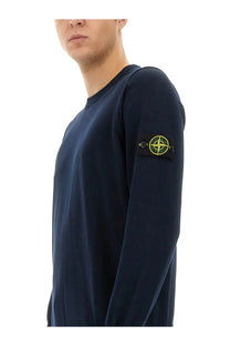 Stone Island men’s navy blue long-sleeved jersey shirt with crew neck and yellow black logo patch on left sleeve