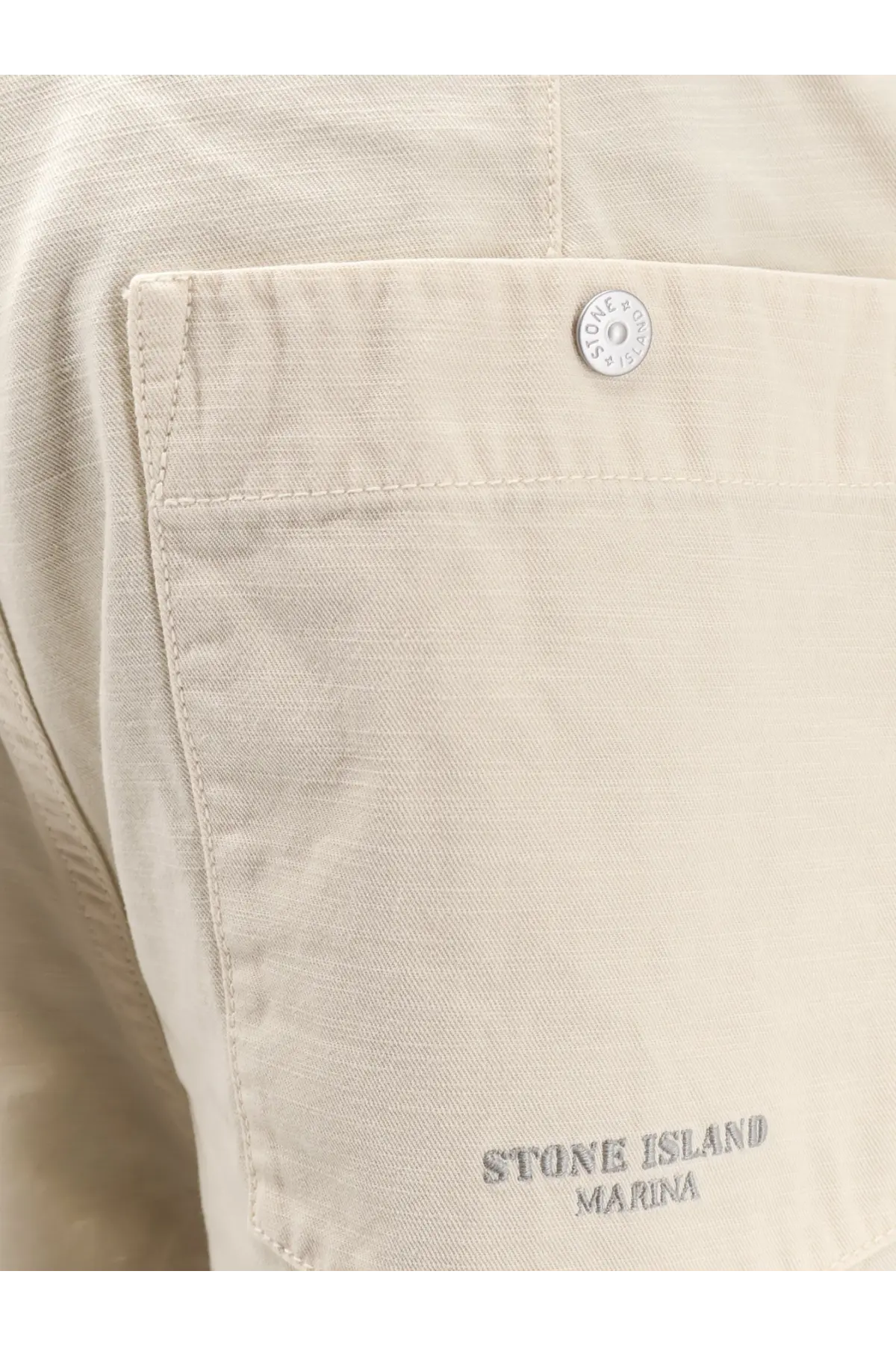 Stone Island men’s loose white cotton trousers with beige stone island marina cotton pocket and silver button detail
