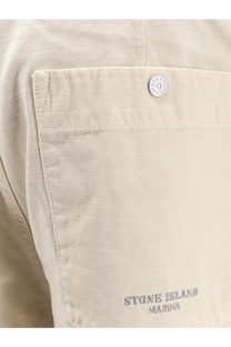 Stone Island men’s loose white cotton trousers with beige stone island marina cotton pocket and silver button detail
