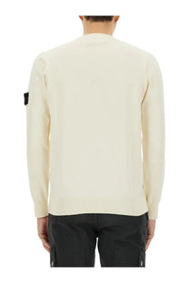 Stone Island men’s cream-colored knit sweater with ribbed hem cuffs and black patch on the left sleeve