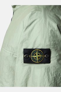 Stone island men’s membrana 3l tc jacket green with black embroidered patch featuring green and yellow compass rose