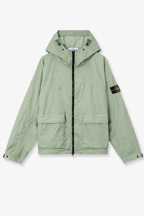 Stone Island men’s membrana 3L TC jacket in light green with black zipper and two front pockets