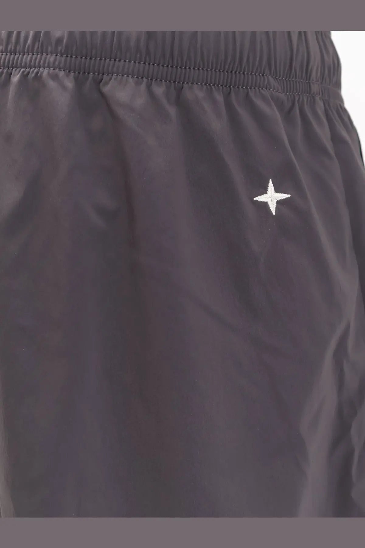 Stone island men’s black nylon athletic shorts with a white star logo embroidered on the side