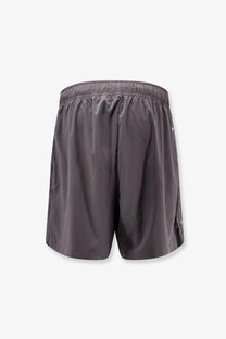 Stone island men’s nylon bermuda shorts grey featuring dark gray color elastic waistband and subtle side branding