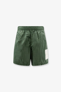 Stone island men’s olive green lightweight nylon swim trunks with elastic waistband and white patch on lower right leg