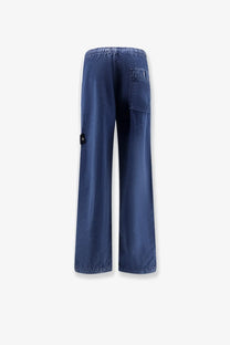 Stone Island men’s blue nylon trousers with wide-leg fit white side stripe and elastic waistband front view