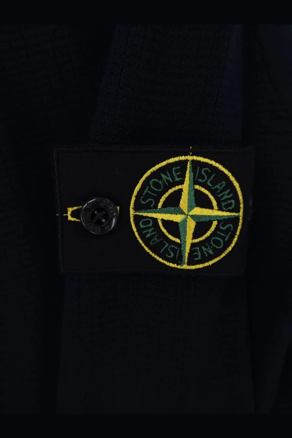 Stone island mens organic cotton blue sweater with black stone island patch featuring yellow and green compass rose logo