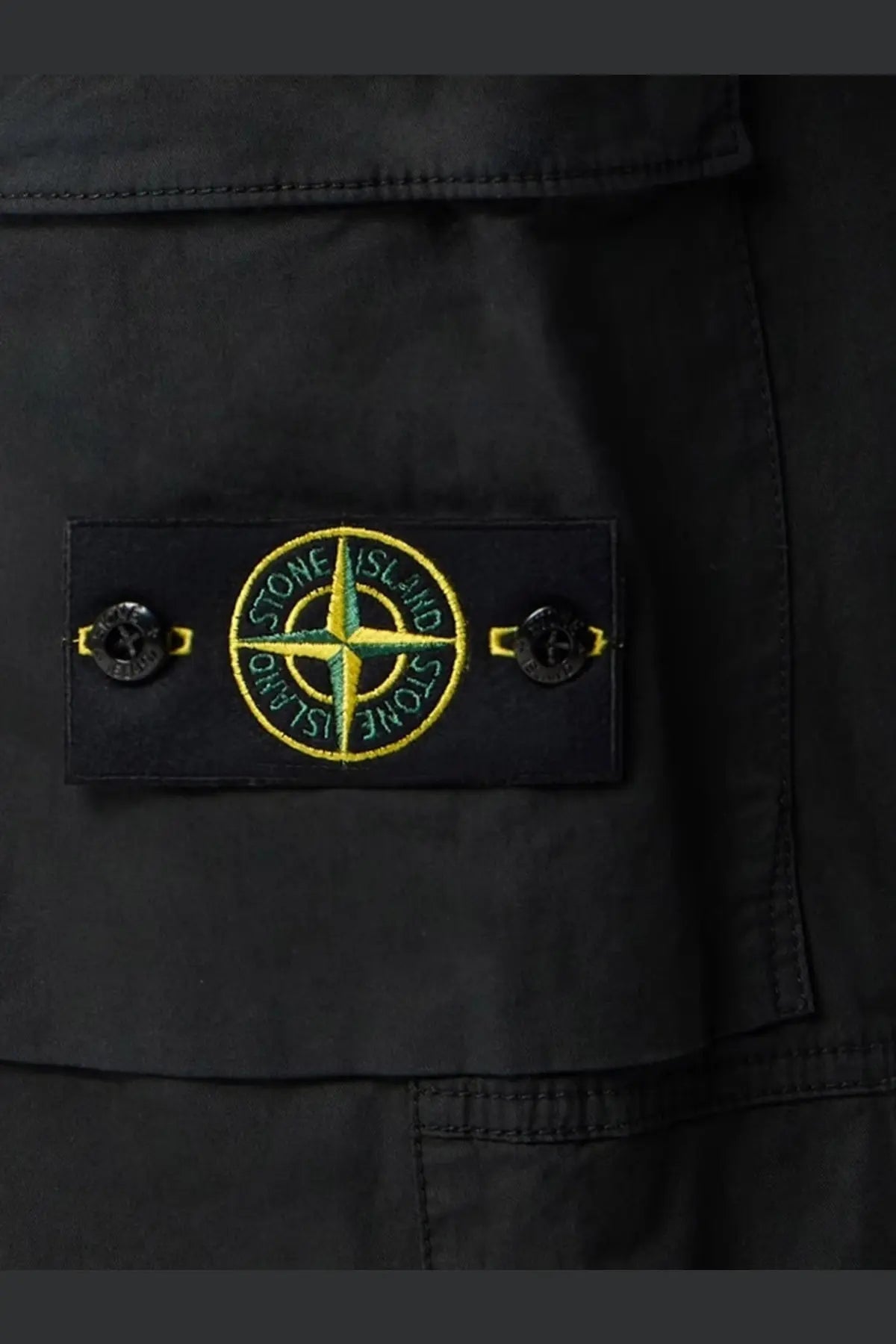 Stone island men’s organic cotton trousers black with black stone island patch featuring yellow green compass rose