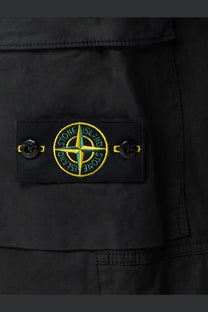 Stone island men’s organic cotton trousers black with black stone island patch featuring yellow green compass rose