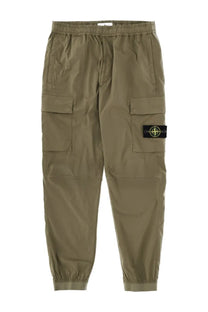 Stone Island men’s olive green cargo pants with black logo patch on thigh in parachute green color