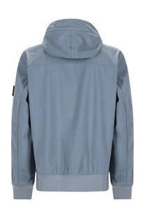 Stone Island men’s light blue hooded parka with sleek modern design and subtle seam detailing